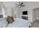 Open main bedroom featuring a ceiling fan, and a view to the primary bathroom at 2013 Waterton Ln, Apex, NC 27502