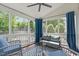 Relaxing screened-in patio with comfortable seating and a backyard view at 2013 Waterton Ln, Apex, NC 27502