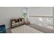 Upstairs playroom featuring carpeting, a storage unit, and view of the stairwell at 2013 Waterton Ln, Apex, NC 27502