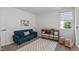 Bright playroom features carpeting, a storage unit, and space for activities at 2013 Waterton Ln, Apex, NC 27502