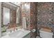 Chic powder room features floral wallpaper, a stylish mirror, and a modern vanity at 2013 Waterton Ln, Apex, NC 27502
