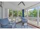 Cozy screened porch featuring comfortable seating and a view of the backyard at 2013 Waterton Ln, Apex, NC 27502