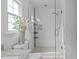 Updated shower with a glass surround, white subway tile, and a rainfall showerhead at 2013 Waterton Ln, Apex, NC 27502