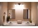 Bathroom featuring double vanity with mirrors, ample counter space, and storage at 205 Windbyrne Dr, Cary, NC 27513