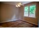 Bedroom features hardwood floors, natural light, and a ceiling fan at 205 Windbyrne Dr, Cary, NC 27513