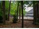 View of playground and outdoor recreation area nestled amongst lush trees, highlighting outdoor recreation at 205 Windbyrne Dr, Cary, NC 27513