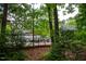 View of the community amenities nestled amongst trees, highlighting outdoor recreation at 205 Windbyrne Dr, Cary, NC 27513