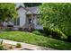 Charming front view of a home with mature trees, lush lawn, and welcoming facade at 205 Windbyrne Dr, Cary, NC 27513