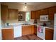 Functional kitchen with appliances, ample counter space and view into adjacent living area at 205 Windbyrne Dr, Cary, NC 27513
