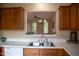 View of a kitchen featuring a pass-through window, offering an open connection to the living space at 205 Windbyrne Dr, Cary, NC 27513
