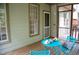Cozy screened porch with comfortable furniture and tranquil setting perfect for relaxation at 205 Windbyrne Dr, Cary, NC 27513