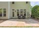 Outdoor patio space features stone pavers, chair seating, and a lush, green backyard at 216 Beringer Pl, Chapel Hill, NC 27516