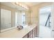 Bathroom with an expansive countertop, cabinet storage, and modern lighting fixture at 216 Beringer Pl, Chapel Hill, NC 27516