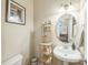 Well-lit powder room featuring a pedestal sink and decorative elements at 216 Beringer Pl, Chapel Hill, NC 27516