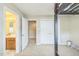 Spacious bedroom showcasing a connecting bathroom, closet, and neutral carpeting at 216 Beringer Pl, Chapel Hill, NC 27516