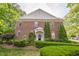 Charming brick home with manicured landscaping and a covered entryway, offering classic curb appeal at 216 Beringer Pl, Chapel Hill, NC 27516