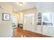 Spacious entry foyer with hardwood floors and a custom built-in display at 216 Beringer Pl, Chapel Hill, NC 27516