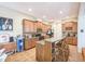 Spacious kitchen with brown cabinets, granite countertops, and a breakfast bar with seating at 216 Beringer Pl, Chapel Hill, NC 27516