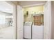 Convenient laundry closet includes washer, dryer, shelving and easy access from bedroom at 216 Beringer Pl, Chapel Hill, NC 27516