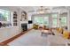 Bright living room boasts coffered ceilings, fireplace, built-in shelving, and natural light at 216 Beringer Pl, Chapel Hill, NC 27516