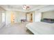 Large main bedroom featuring a tray ceiling, ceiling fan, and access to ensuite bath and walk-in closet at 216 Beringer Pl, Chapel Hill, NC 27516