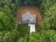 Stunning aerial view of the property nestled among lush greenery and mature trees at 249 Rawhide Dr, Louisburg, NC 27549