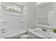 Bright bathroom features a shower-tub combo and marble countertops at 249 Rawhide Dr, Louisburg, NC 27549