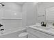 Bright bathroom featuring tiled backsplash and a shower-tub combination at 249 Rawhide Dr, Louisburg, NC 27549