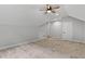 Bright, carpeted bedroom with a ceiling fan and ample space at 249 Rawhide Dr, Louisburg, NC 27549