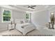 Light-filled bedroom with neutral tones, tray ceiling, and plush carpeting for a cozy feel at 249 Rawhide Dr, Louisburg, NC 27549