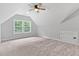 Bright, carpeted bedroom with a ceiling fan and natural light at 249 Rawhide Dr, Louisburg, NC 27549
