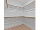 Walk-in closet with wood shelving and wood-look flooring at 249 Rawhide Dr, Louisburg, NC 27549