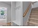 This entryway includes a coat rack, bench, cubbies and stairs at 249 Rawhide Dr, Louisburg, NC 27549