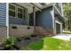 Beautifully landscaped entrance with brickwork and well maintained yard at 249 Rawhide Dr, Louisburg, NC 27549