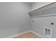 Empty laundry room with wood-look floors and utility connections at 249 Rawhide Dr, Louisburg, NC 27549