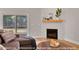 Cozy living room featuring a stylish fireplace and easy access to the outdoor deck at 249 Rawhide Dr, Louisburg, NC 27549