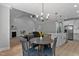 Open floor plan showcasing the kitchen, dining, and living area with vaulted ceilings at 249 Rawhide Dr, Louisburg, NC 27549