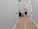 Open-concept view of living room with fireplace, hardwood floors, and access to the backyard at 249 Rawhide Dr, Louisburg, NC 27549