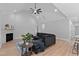 Spacious living room with vaulted ceiling, fireplace, and comfortable seating area at 249 Rawhide Dr, Louisburg, NC 27549