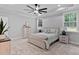 Serene main bedroom with tray ceiling, neutral tones, and ample natural light at 249 Rawhide Dr, Louisburg, NC 27549