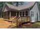 Charming rear deck offering a relaxing space with access to the screened porch and backyard at 249 Rawhide Dr, Louisburg, NC 27549