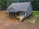 Inviting rear exterior featuring a screened porch and open deck, perfect for outdoor enjoyment at 249 Rawhide Dr, Louisburg, NC 27549