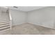 Spacious carpeted bonus room with stairway at 2705 Wyntercrest Ln, Durham, NC 27713
