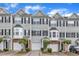 Charming townhomes featuring symmetrical designs and attached garages at 2705 Wyntercrest Ln, Durham, NC 27713