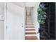 Entryway showing the front door, stairway and hardwood floors at 2705 Wyntercrest Ln, Durham, NC 27713