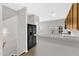 Kitchen featuring a breakfast bar and black appliances at 2705 Wyntercrest Ln, Durham, NC 27713