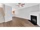 Spacious living room with fireplace, stairs, and wood floors at 2705 Wyntercrest Ln, Durham, NC 27713
