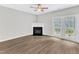 Living room with a fireplace, ceiling fan, and patio access at 2705 Wyntercrest Ln, Durham, NC 27713