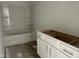 Bathroom with white tub and shower combination and pre-install cabinets at 2874 Quarry Rd # 165, Rolesville, NC 27571