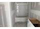 Unfinished bathroom featuring a tub-shower combo with built in shelving, new construction at 2874 Quarry Rd # 165, Rolesville, NC 27571